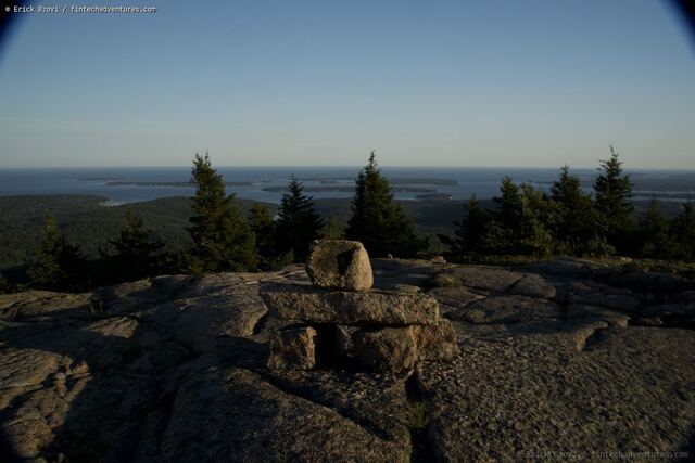 Stone cairn at the summit of Cadillac Mountain overlooking the Porcupine Islands in Acadia National Park, Maine