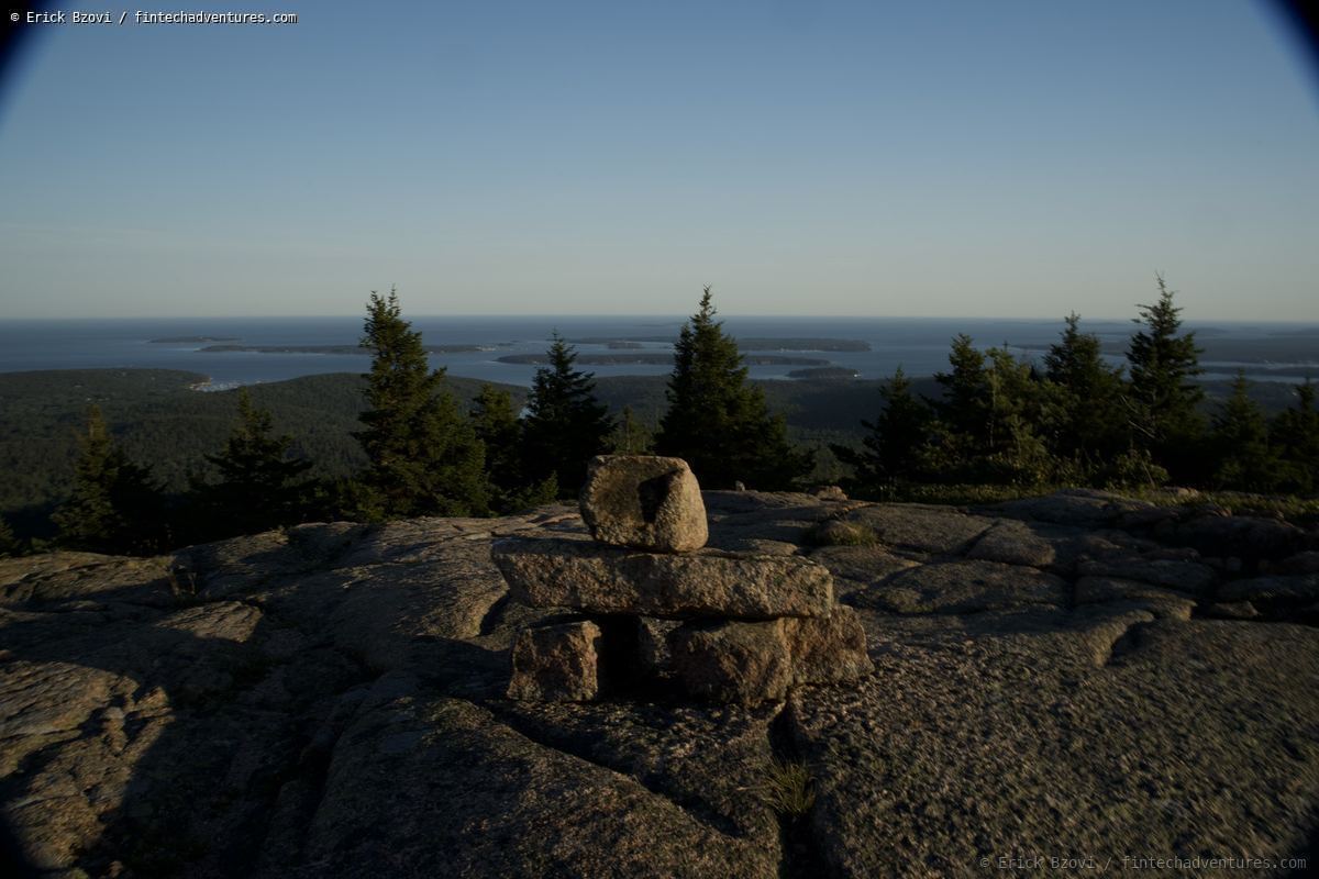 Stone cairn at the summit of Cadillac Mountain overlooking the Porcupine Islands in Acadia National Park, Maine