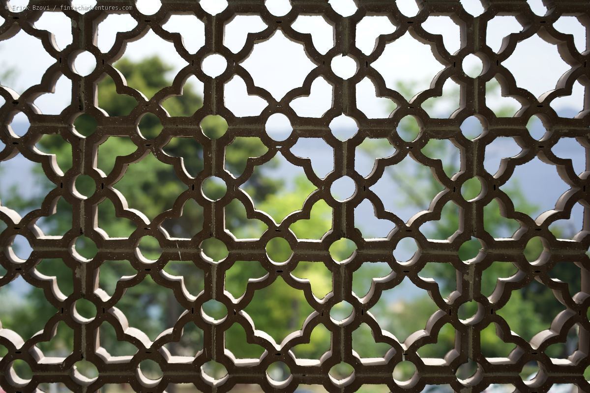 Ornamental iron lattice work with garden view, Croatia