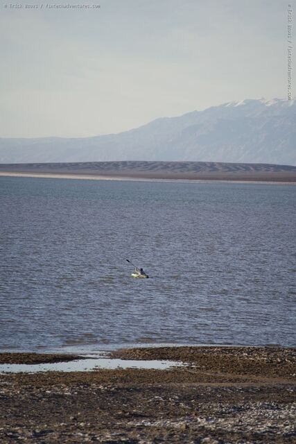 Salt flats and shallow water at Badwater Basin with the Panamint Range rising in the distance, Death Valley National Park