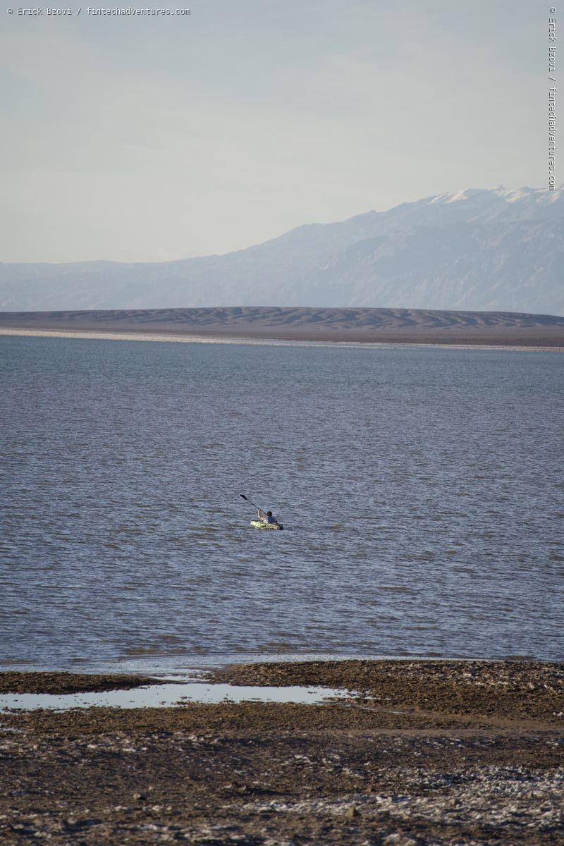 Salt flats and shallow water at Badwater Basin with the Panamint Range rising in the distance, Death Valley National Park