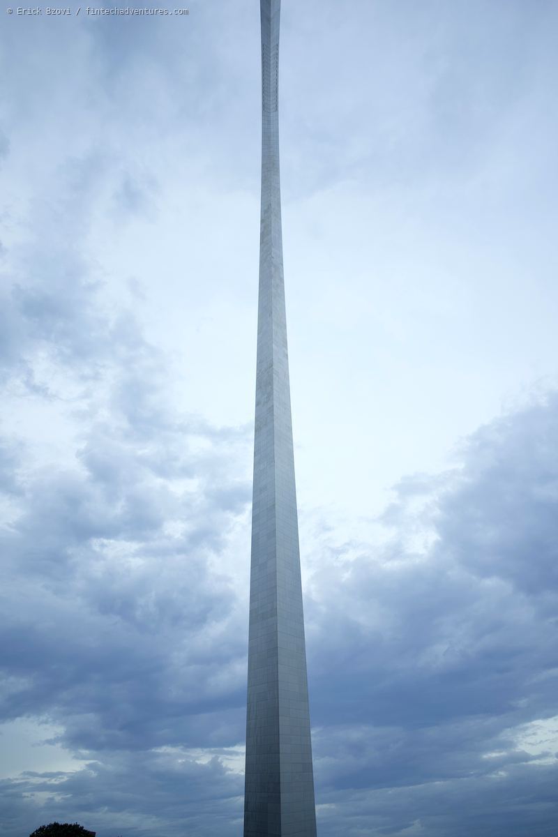 Gateway Arch towering into overcast sky, looking straight up from the base, St. Louis, Missouri