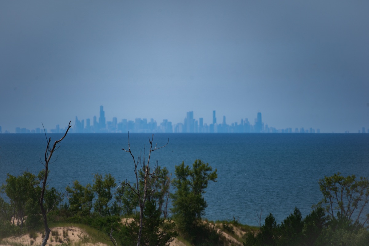 Chicago skyline faintly visible across Lake Michigan from the dunes in Indiana