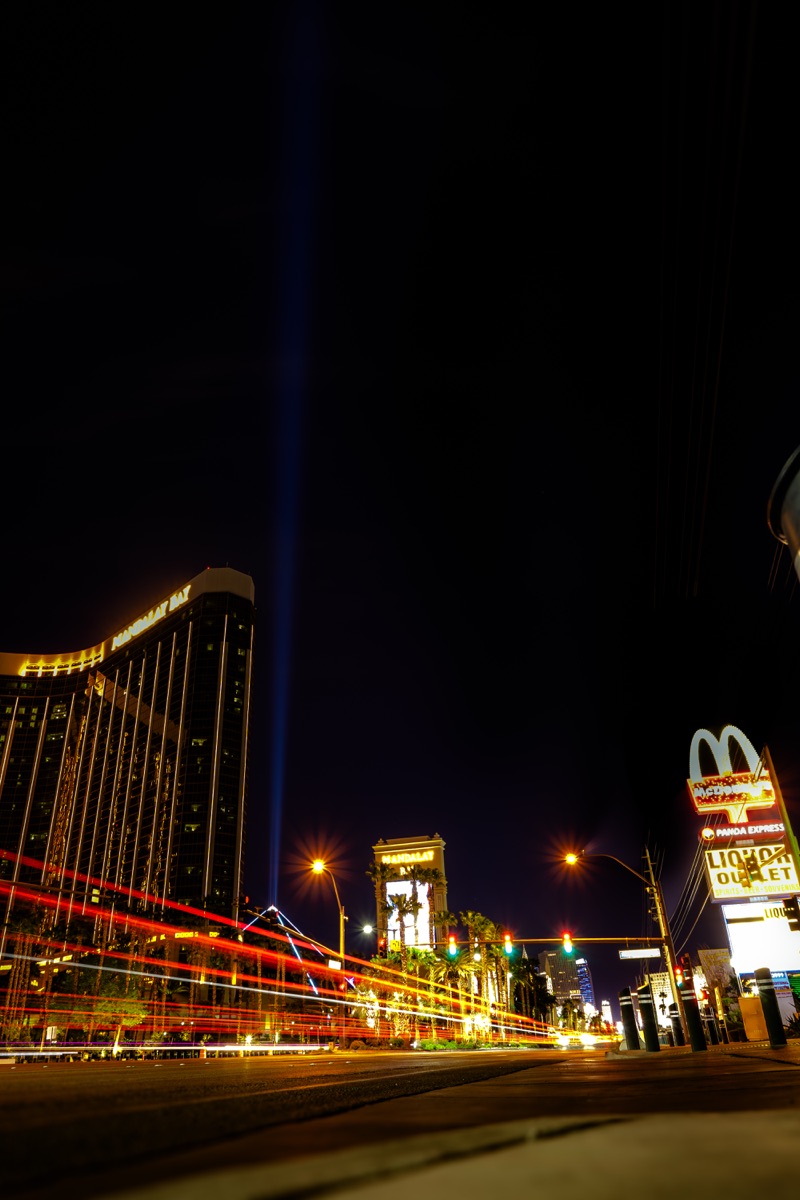 Long-exposure traffic lights and casino signs along the Las Vegas Strip at night