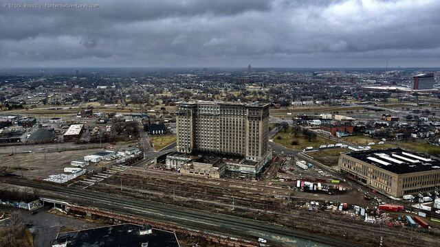 Aerial drone view of Michigan Central Station under restoration above the Corktown rail yard, Detroit, Michigan