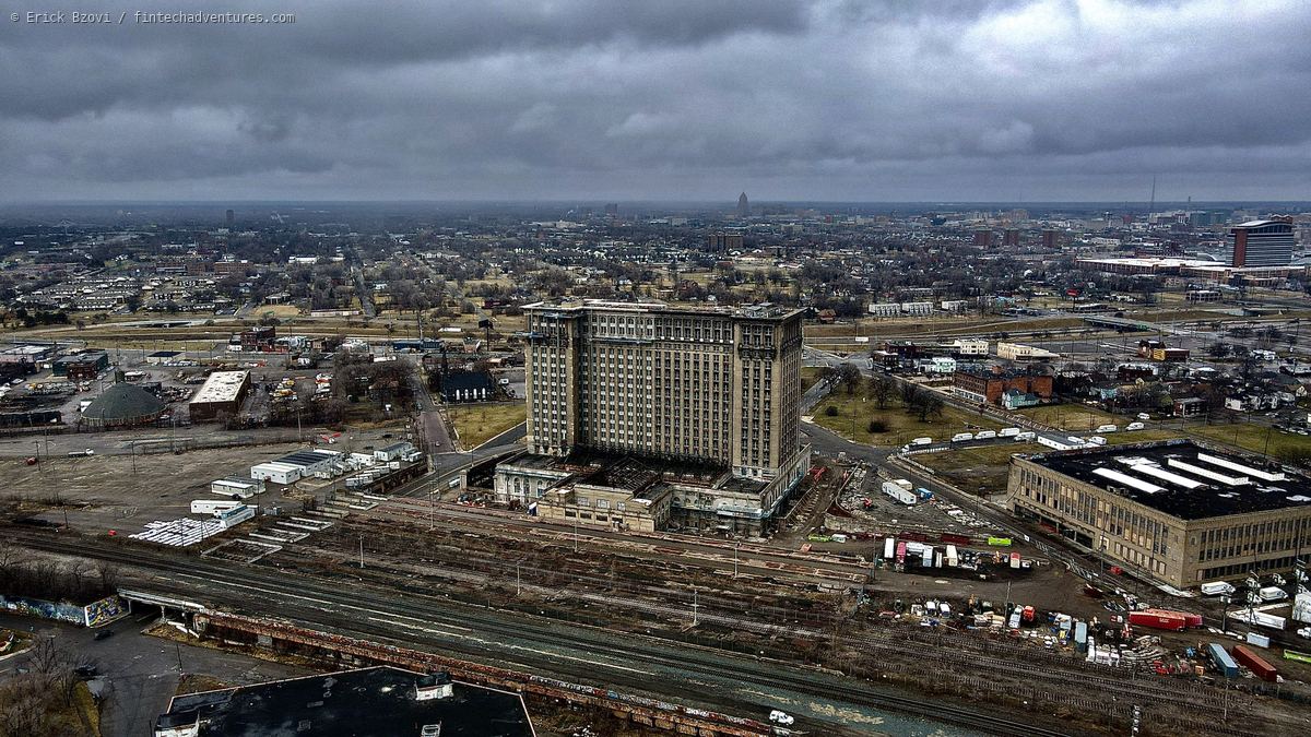 Aerial drone view of Michigan Central Station under restoration above the Corktown rail yard, Detroit, Michigan