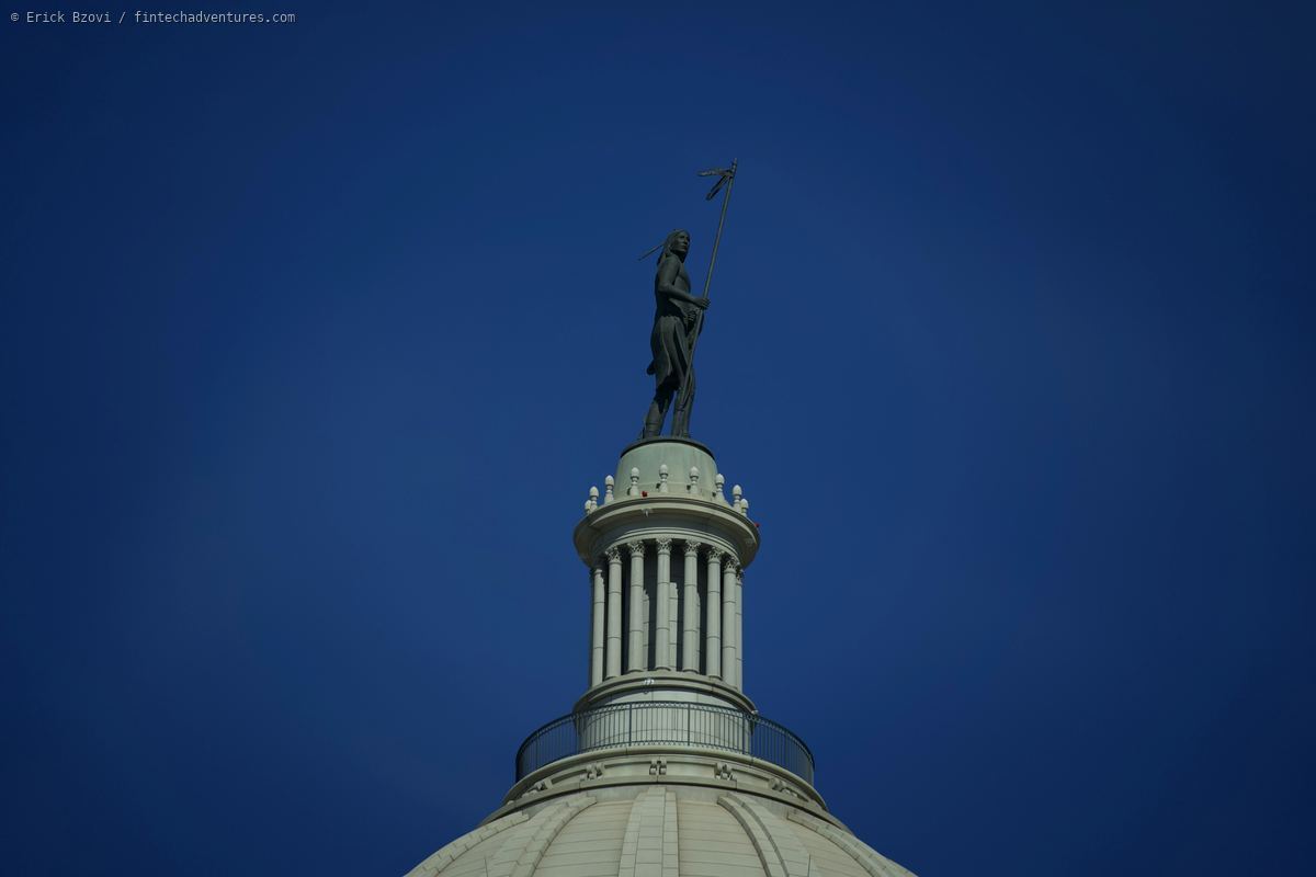 The Guardian statue atop the Oklahoma State Capitol dome against deep blue sky
